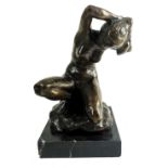 A 20TH CENTURY BRONZE STUDY OF A NUDE FEMALE BATHER Kneeling on a rock and raised on a black