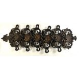 A 19TH FRENCH CAST IRON WALL HANGING ROCOCO FORM LETTER RACK With embossed shell and scroll