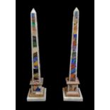 A PAIR OF ITALIAN SPECIMEN MARBLE OBELISK Of tapering form with geometric design over a stepped