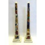 A PAIR OF ITALIAN SPECIMEN MARBLE PYRAMID FORM OBELISKS On a square pedestal base, set with