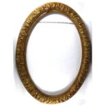 AN OVAL GILT FRAME DECORATED IN RELIEF WITH FLOWERS AND FOLIAGE. (w 65cm x h 92cm)