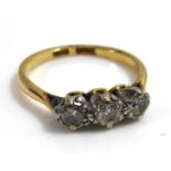 AN 18CT GOLD THREE STONE DIAMOND RING (size M/N).