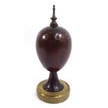 THEO FABERGÉ, A 20TH CENTURY ?PURPLE HEART? FABERGÉ EGG With shaped finial over ring inlay, raised