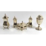 A COLLECTION OF FOUR EARLY 20TH CENTURY SILVER PEPPERETTES Comprising a pair hallmarked Walker &