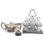 AN EARLY 20th CENTURY SILVER PLATED SIX BOTTLE CRUET SET rectangular frame with cut lead crystal