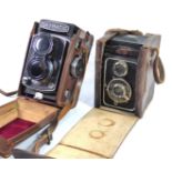 TWO VINTAGE BOX CAMERAS To include a Skymatic camera and Eho camera, both with tan leather cases. (