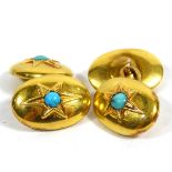A PAIR OF GOLD PLATED OVAL CUFFLINKS With turquoise set star motif.