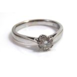 AN 18CT WHITE GOLD AND DIAMOND SOLITAIRE RINGa single round cut stone in a plain mount.Approx 0.33ct