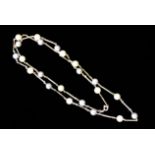 AN 18CT WHITE GOLD AND PEARL NECKLACE With alternating grey and white pearls interspersed by