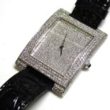 AN 18CT WHITE GOLD AND DIAMOND GENT?S WRISTWATCH Having pavé set diamonds to dial and bezel, a