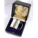 A CASED EARLY 20TH CENTURY SILVER CHRISTENING MUG Of plain form, hallmarked Chester, 1913 ,