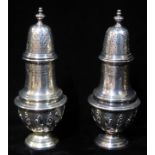 GARRARD OF LONDON, A PAIR OF VICTORIAN SILVER BALUSTER SUGER CASTORS With a pierced dome form