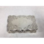 GEORGE UNITE, A VICTORIAN SILVER RECTANGULAR SNUFF BOX With scrolled edge engraved decoration and