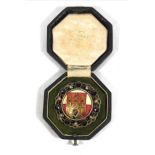 A CZECH SILVER, GARNET AND ENAMEL TRADE PRESENTATION MEDAL Bearing the Prague coat of arms to centre