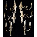 A SET OF FOUR LATE 19TH/EARLY 20TH CENTURY GILT METAL WALL SCONCES Lozenge form back plate with