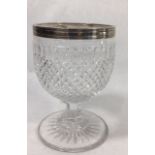 A GEORGIAN SILVER AND CUT CRYSTAL GLASS GOBLET Having plain silver band to rim and hobnail cut body,