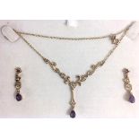 A 9CT GOLD, AMETHYST AND SEED PEARL NECKLACE AND EARRINGS SET Scrolled floral design with tear cut