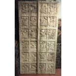 A 19TH CENTURY INDIAN HARDWOOD DOOR/PANEL With twenty-four hand carved sections, scenes from The