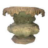 A TERRACOTTA PLANTER With grape and vine draped collar above eight facial masks. (diameter 50cm x