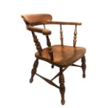 A VICTORIAN ELM AND BEECH CAPTAIN'S CHAIR With turned Roman spindles. (62cm x 50cm x 78cm)