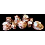 A COLLECTION OF 20TH CENTURY JAPANESE KUTANI EGG SHELL PORCELAIN Comprising a teapot, six cups,