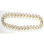 AN 18CT WHITE GOLD, DIAMOND AND SOUTHSEA PEARL NECKLACE The single row of pearls with white gold and