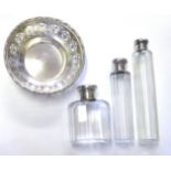 A COLLECTION OF THREE VICTORIAN SILVER AND CUT GLASS TRINKET BOTTLES Each having screw caps,