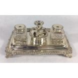 A VICTORIAN SILVER AND CUT GLASS RECTANGULAR INKSTAND With a gadrooned shell border, set with a