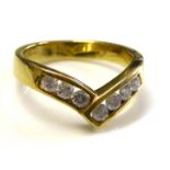 AN 18CT GOLD AND DIAMOND WISHBONE RING Having a single row of round cut diamonds (size L/M).