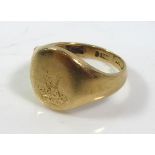 A VICTORIAN 9CT GOLD SIGNET RING Plain form with engraved family crest (size D). crest worn