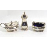 A 20TH CENTURY SILVER THREE PIEC CRUET SET Having a gadrooned border and blue glass liners,