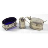 A GEORGIAN DESIGN SILVER THREE PIECE OVAL CRUET SET With pierced decoration and blue glass liners,