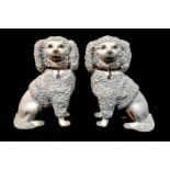 STAFFORDSHIRE, A PAIR OF VICTORIAN PORCELAIN DOGS Modelled as poodles with confetti design