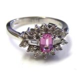 AN 18CT WHITE GOLD, PINK SAPPHIRE AND DIAMOND RING Having a single baguette cut sapphire flanked