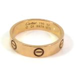 CARTIER, ?LOVE?, AN 18CT ROSE GOLD WEDDING BAND With geometric symbols, marked to interior ?