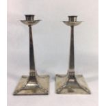 JAMES DIXON & SONS, A PAIR OF EARLY 20TH CENTURY ARTS & CRAFTS DESIGN SILVER CANDLESTICKS With strap