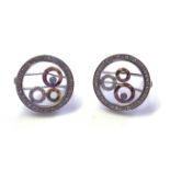 A PAIR OF 18CT WHITE GOLD AND ?HAPPY? DIAMOND EARRINGS Circular frame edged with diamonds,