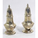 A PAIR OF EARLY 20TH CENTURY SILVER OCTAGONAL FORM PEPPERETTES With pierced dome, hallmarked