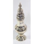 AN EARLY 20TH CENTURY SILVER SUGAR CASTER Having a scrolled and pierced dome finial and baluster