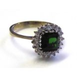 AN 18CT WHITE GOLD, TOURMALINE AND DIAMOND RING Having a single square cut stone edged with diamonds