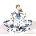 MEISSEN, A 19TH CENTURY PORCELAIN FIGURAL TABLE SALT Maiden seated with two baskets with