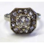 A FRENCH ART DECO 18CT WHITE GOLD AND DIAMOND RING Having a single round cut diamond edged with