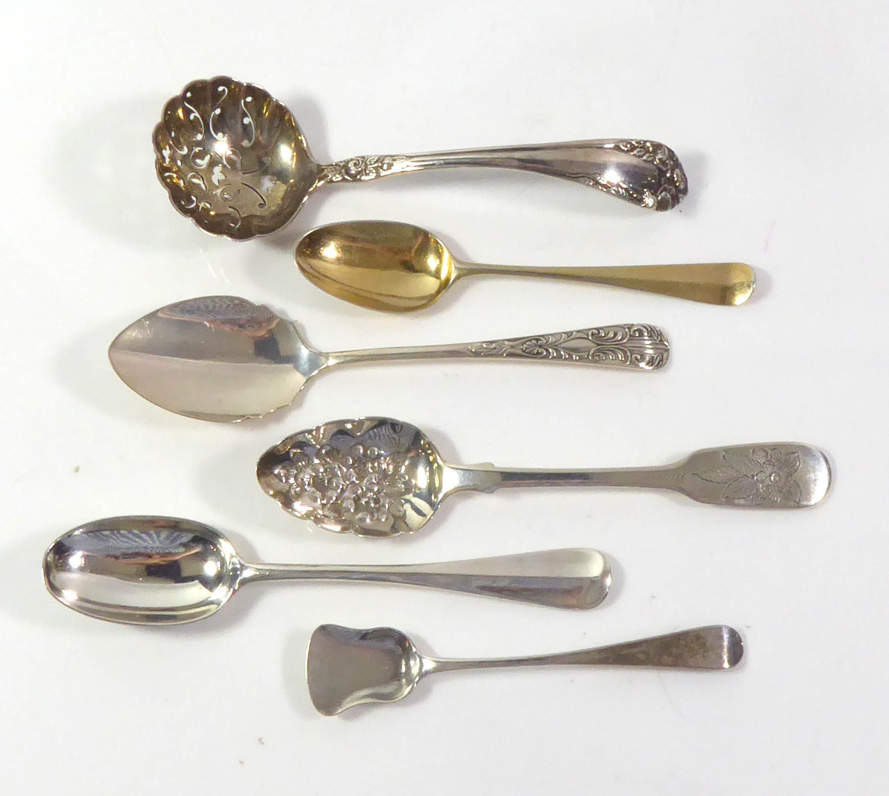 A COLLECTION OF GEORGIAN AND LATER SILVER SPOONS Comprising a silver gilt shell back teaspoon, by