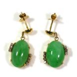 A PAIR OF 18CT GOLD, NATURAL JADE AND DIAMOND EARRINGS Having a cabochon cut jade stone flanked with