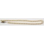 A VINTAGE CULTURED PEARL NECKLACE The single row of pearls set with a Swedish silver clasp,