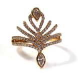 AN 18CT GOLD AND DIAMOND SPRAY RING The pear cut diamond set with round cut diamond strands, with