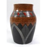 JOHN BUTLER FOR WILKINSON LTD POTTERY, AN ART DECO PERIOD OVOID VASE With ribbed body and strong