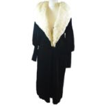 NO LABEL, VINTAGE BLACK VELVET COAT With white 'fur' collar, central black square button, leg of