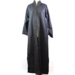 NO LABEL, BLACK 'COTTON' ANKLE LENGTH COAT With red 'silk' lining, black embroidered design along