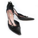 PRADA, BLACK LEATHER HEELS With floral decoration and pointed toe (size 40). (heel 9.5cm)